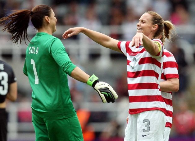 Hope Solo and Christie Rampone celebrate a 2-0 victory over New Zealand on Aug. 3, 2012. (AP)  